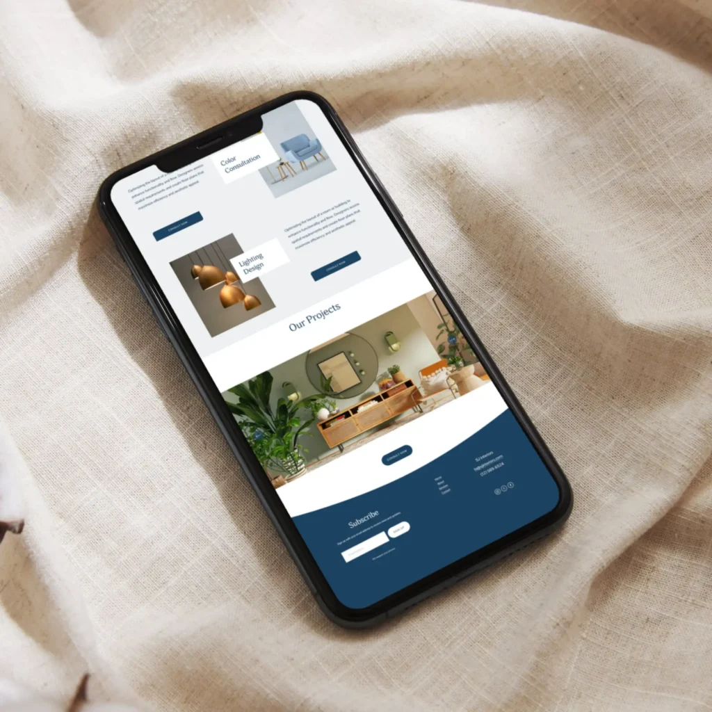Mobile mockup of Florida interior designer website displayed on soft fabric background, showcasing elegant design services.