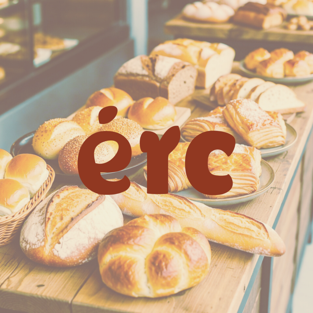 Artisanal bread display with logo signage representing Texas handmade bakery visual identity and warm branding.
