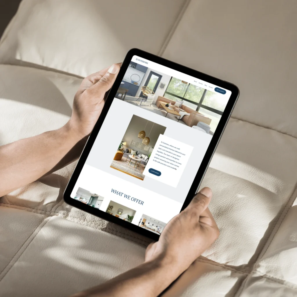 Interior design firm website shown on tablet, highlighting professional branding, curated spaces, and modern aesthetics