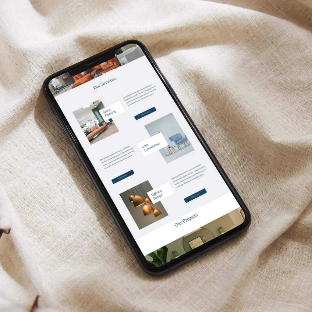 Interior design firm website design displayed on mobile phone featuring modern interior design services